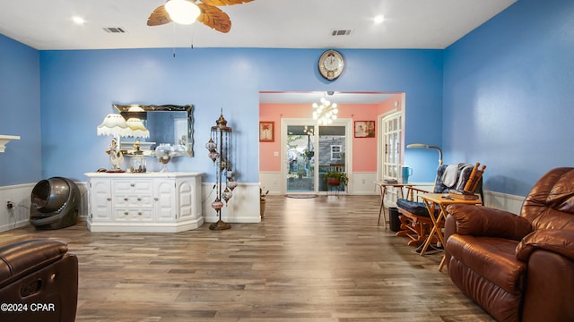 sitting room featuring ceiling fan and wood-type flooring