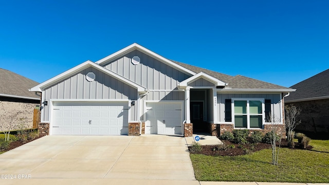 view of front of property with a garage and a front yard