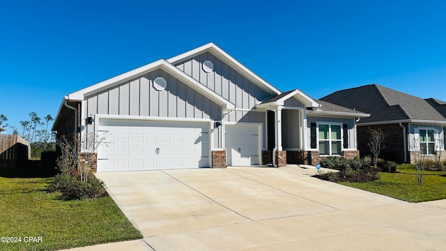 view of front of house with a garage and a front yard