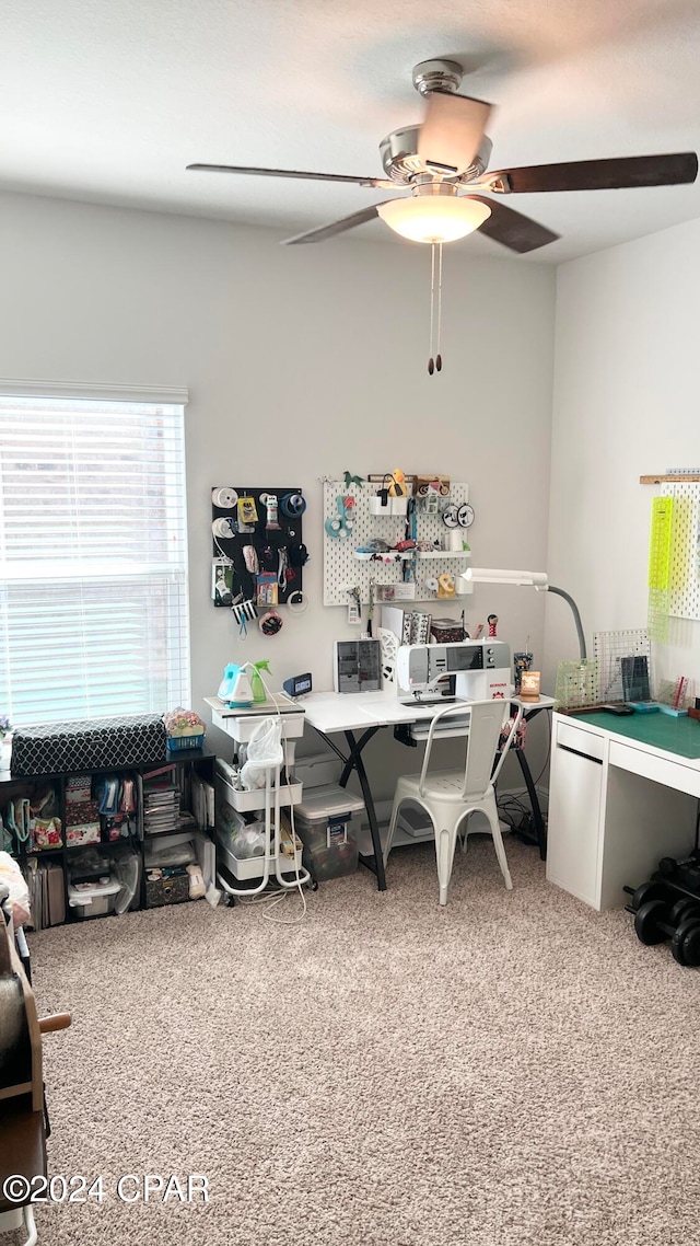 carpeted office with ceiling fan