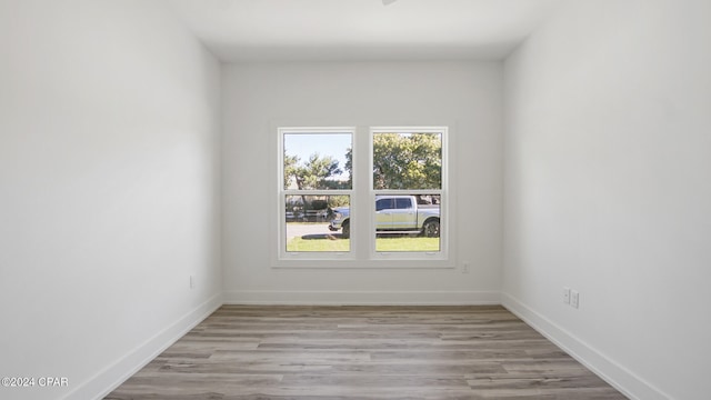 unfurnished room featuring light hardwood / wood-style floors