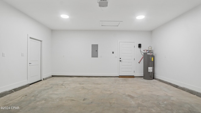 garage with electric panel and electric water heater