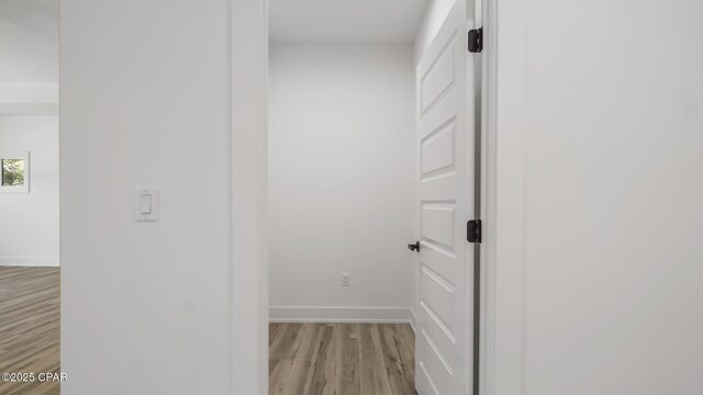 corridor featuring light hardwood / wood-style flooring