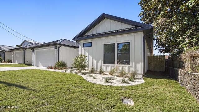 view of front of property with a garage and a front yard