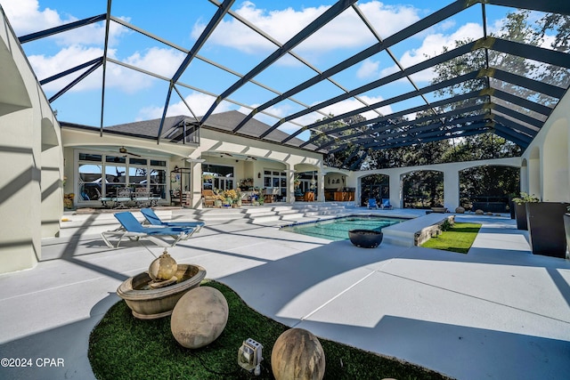 view of pool featuring ceiling fan, a lanai, a jacuzzi, and a patio