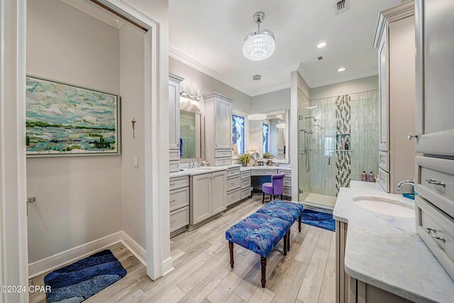 bathroom featuring vanity, ornamental molding, and an enclosed shower