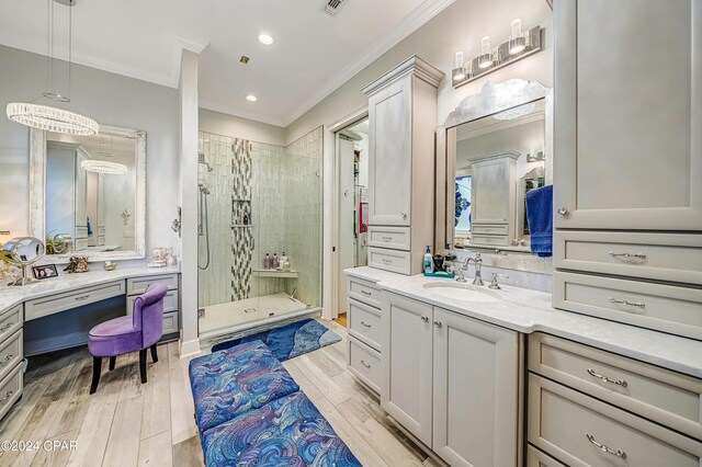 bathroom featuring vanity, crown molding, and walk in shower