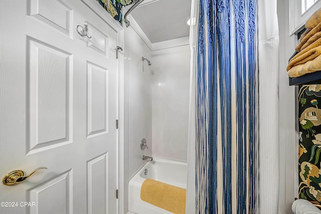 bathroom featuring shower / tub combo with curtain