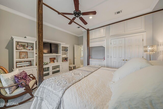 carpeted bedroom with ceiling fan and crown molding