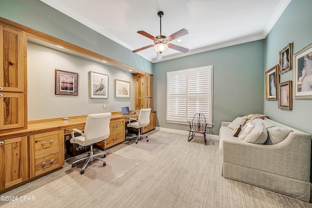 home office featuring ceiling fan, ornamental molding, and light colored carpet