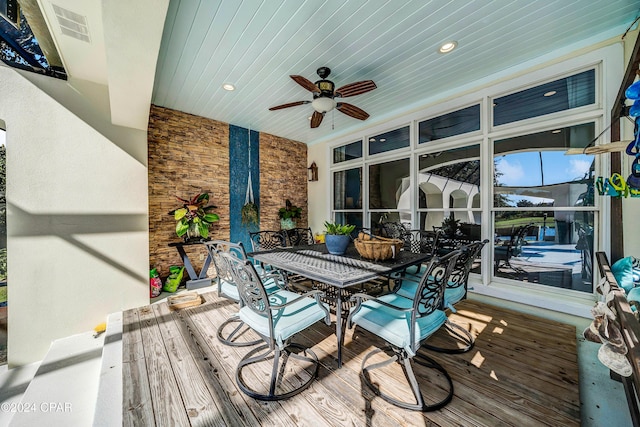 wooden terrace featuring ceiling fan