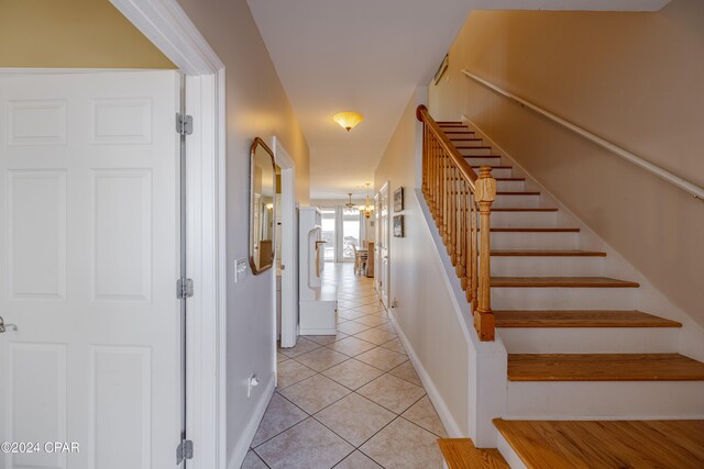 stairs with tile patterned floors