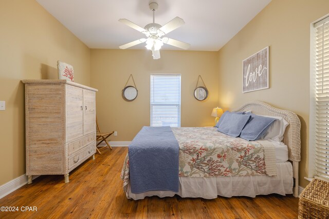 bedroom with hardwood / wood-style flooring and ceiling fan