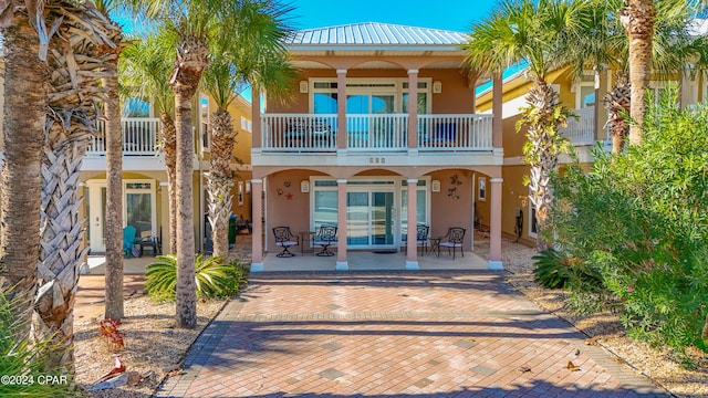 back of house featuring french doors