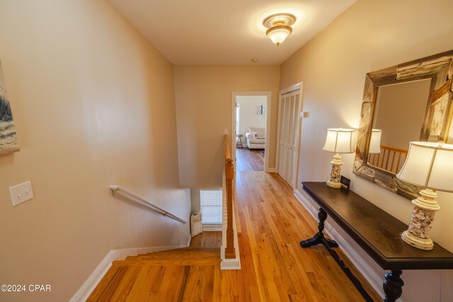 corridor with light wood-type flooring