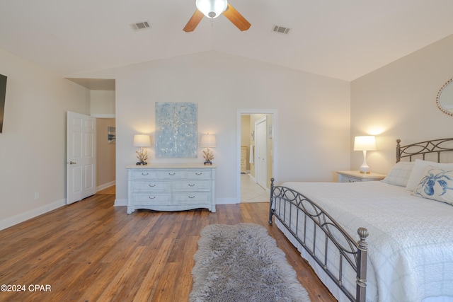 bedroom featuring ceiling fan, wood-type flooring, and lofted ceiling