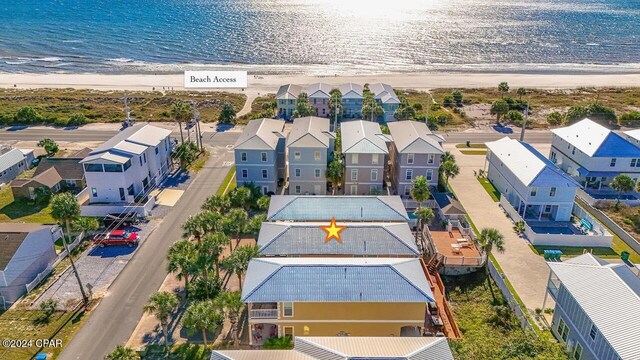 bird's eye view with a water view and a view of the beach