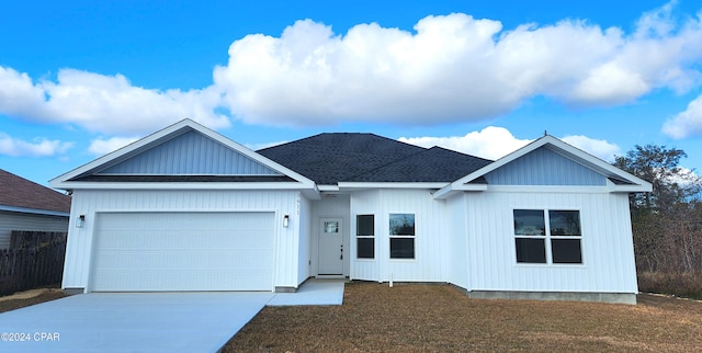 view of front facade with a garage and a front yard