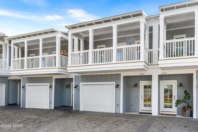 exterior space with a balcony and a garage