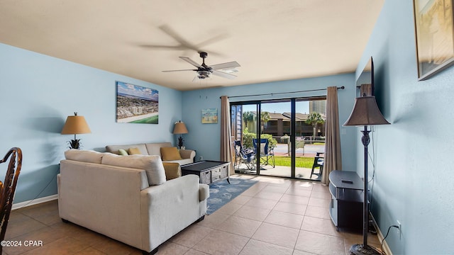 tiled living room with ceiling fan