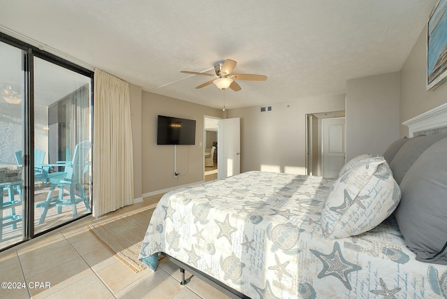 tiled bedroom featuring a textured ceiling, access to outside, and ceiling fan