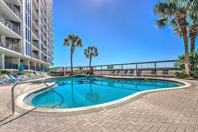 view of pool featuring a patio area