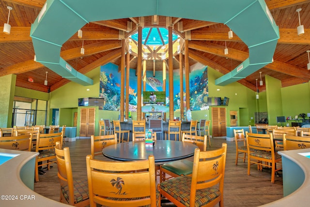 dining space with hardwood / wood-style floors, beamed ceiling, wooden ceiling, and high vaulted ceiling