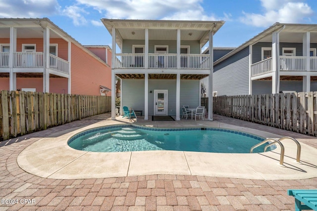 view of swimming pool with a patio