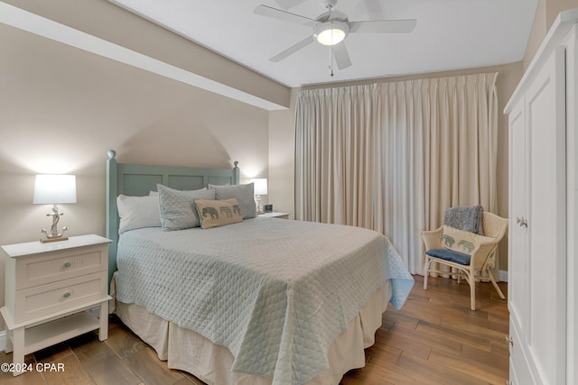 bedroom featuring hardwood / wood-style flooring and ceiling fan