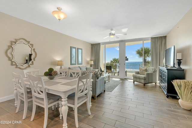 15625 Front Beach Rd Unit 205, Panama City Beach, FL 32413 - dining area with ceiling fan, floor to ceiling windows, and light wood finished floors