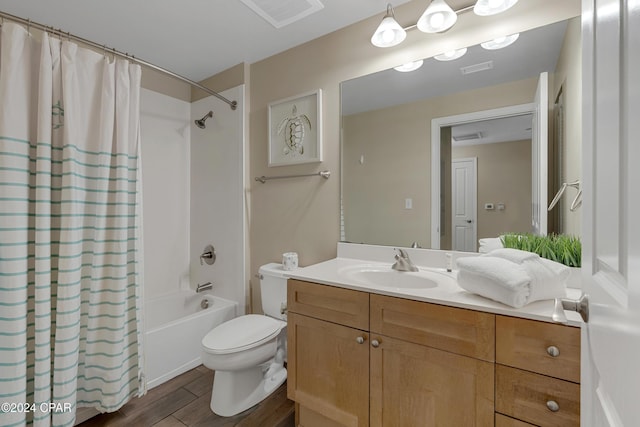 full bathroom with vanity, toilet, and shower / bath combo with shower curtain