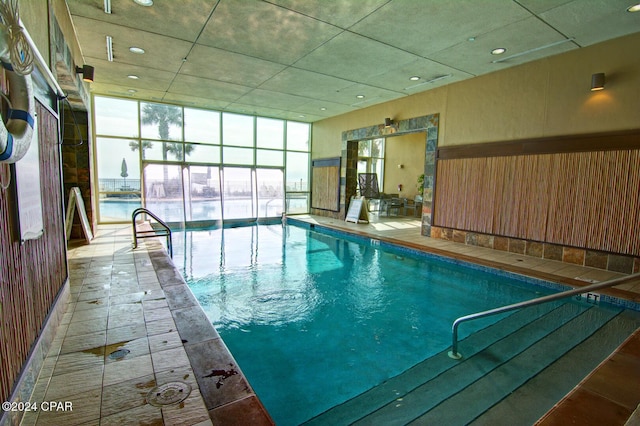 view of pool with a water view