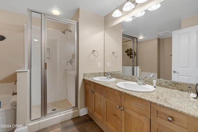15625 Front Beach Rd Unit 205, Panama City Beach, FL 32413 - bathroom featuring a stall shower, double vanity, and wood finished floors