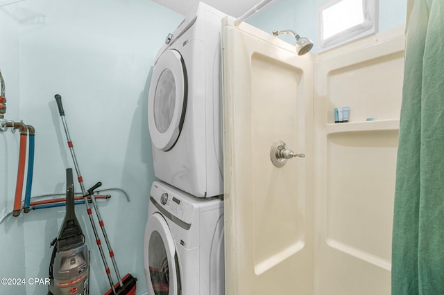 laundry area featuring stacked washer / dryer