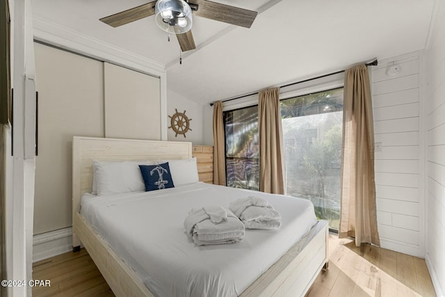 bedroom featuring a closet, ceiling fan, and light hardwood / wood-style flooring