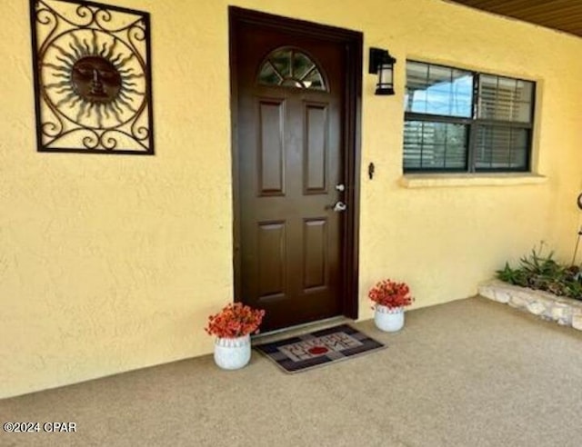 848 Helen Ave, Panama City, FL 32401 - view of exterior entry featuring stucco siding and a porch