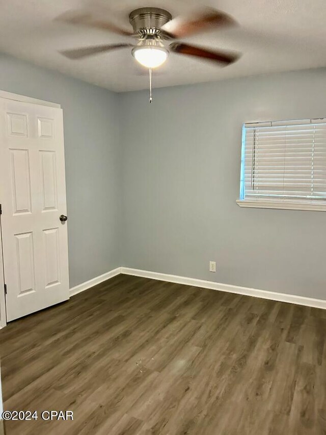 848 Helen Ave, Panama City, FL 32401 - empty room featuring ceiling fan, dark wood-style floors, and baseboards
