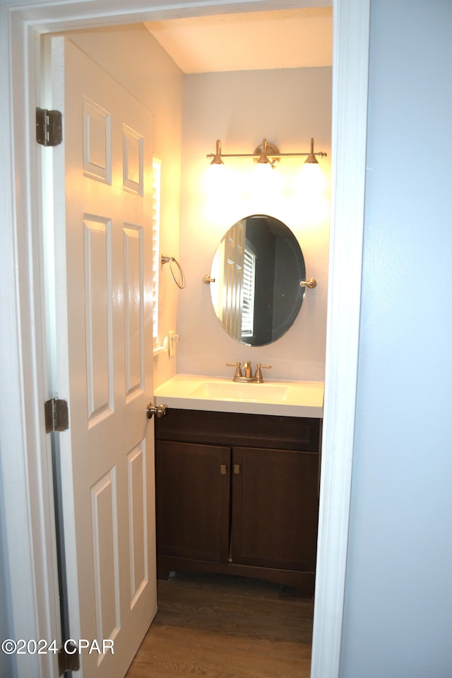 bathroom with vanity and hardwood / wood-style floors