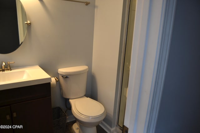 848 Helen Ave, Panama City, FL 32401 - bathroom featuring toilet, vanity, and an enclosed shower