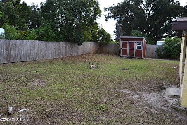 848 Helen Ave, Panama City, FL 32401 - view of yard featuring a storage unit and an outbuilding