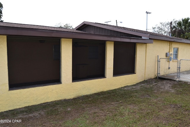 848 Helen Ave, Panama City, FL 32401 - view of home's exterior featuring stucco siding and a gate