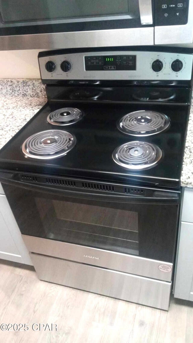 848 Helen Ave, Panama City, FL 32401 - kitchen view of electric range, wood finished floors, and light countertops