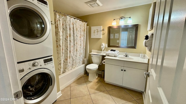 full bathroom featuring vanity, shower / bath combo, stacked washer and clothes dryer, tile patterned floors, and toilet