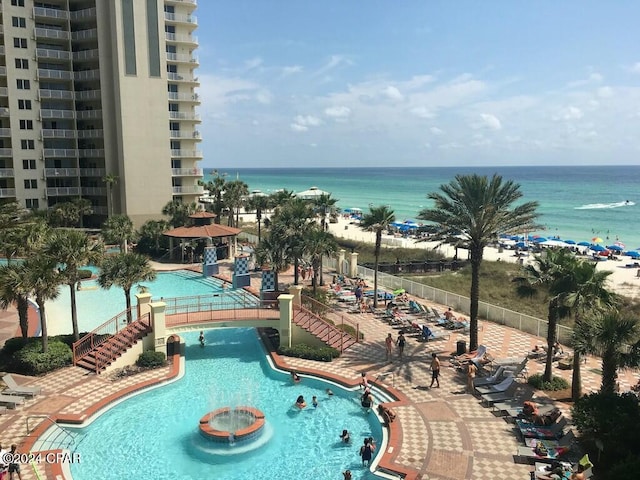 view of pool featuring a water view