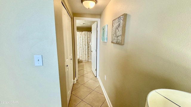 hallway with light tile patterned flooring