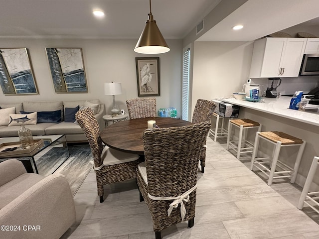 dining area featuring ornamental molding