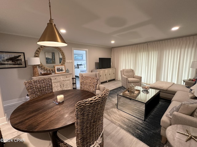 dining room featuring crown molding