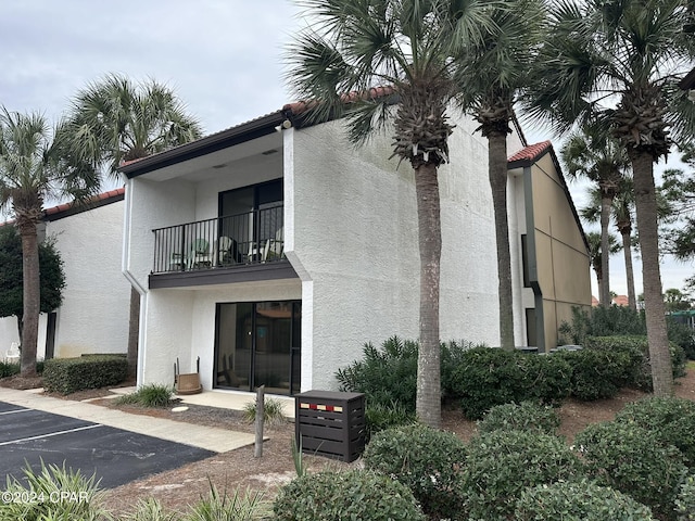 back of house featuring a balcony