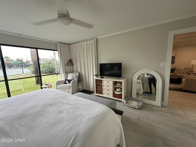 bedroom featuring ceiling fan and crown molding