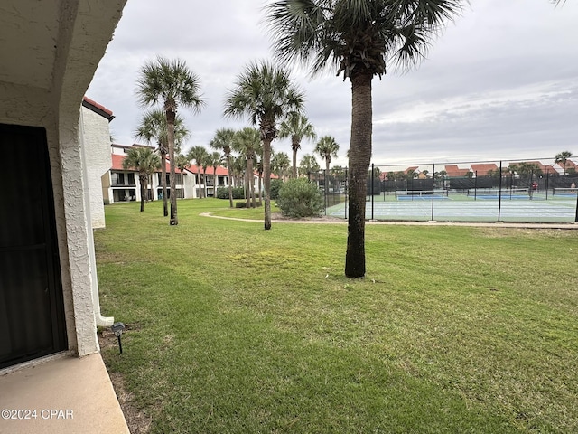 view of yard with tennis court